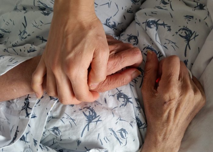holding-elderly-family-member-s-hand-in-hospital-d-2022-11-01-23-58-13-utc